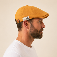 The Urban Flat Cap in yellow, side profile