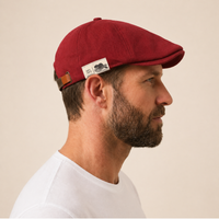 The Urban Flat Cap in red, side profile