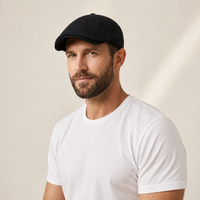 The Urban Flat Cap in black, front view on model