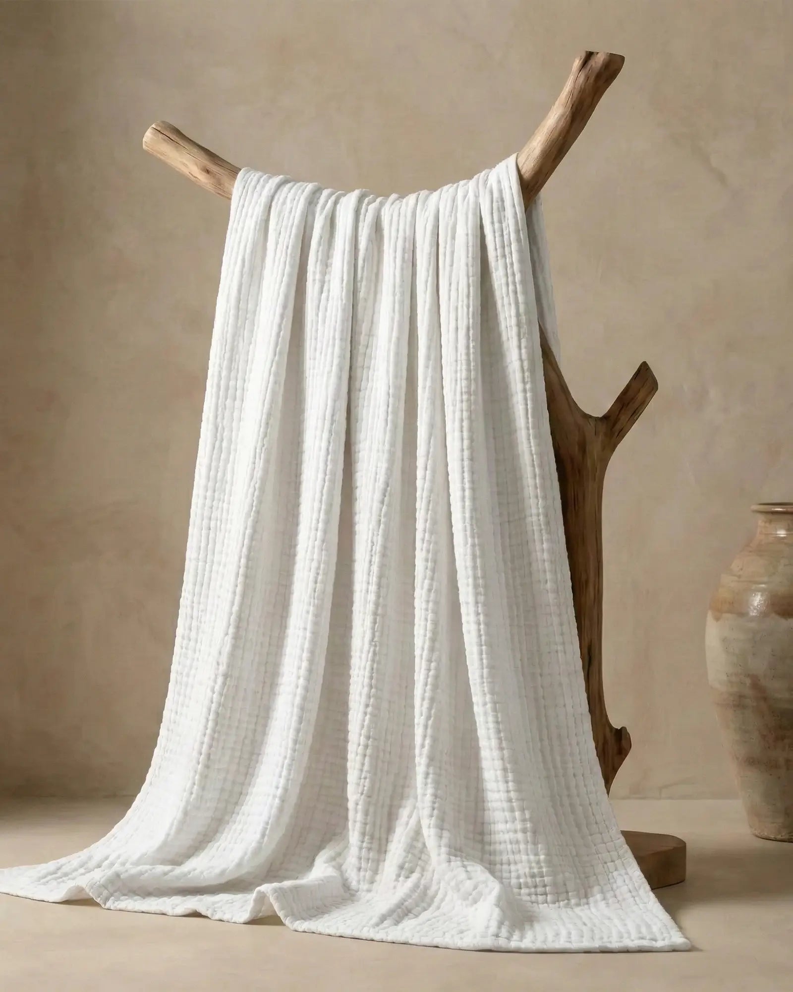 Muslin Blanket in White, close-up of the open cotton weave