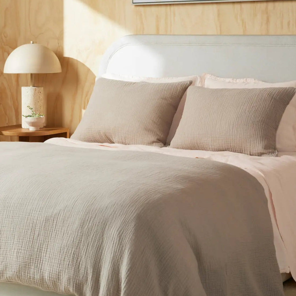 Muslin pillowcases styled on a bed