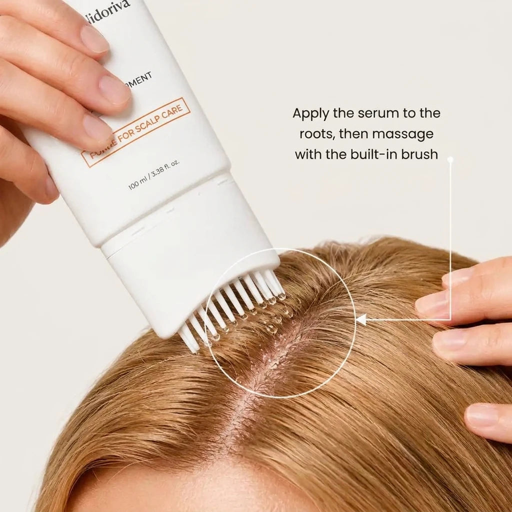 Applying the Nidoriva serum to the roots with the built-in brush