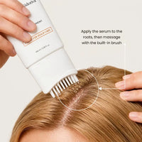 Applying the Nidoriva serum to the roots with the built-in brush