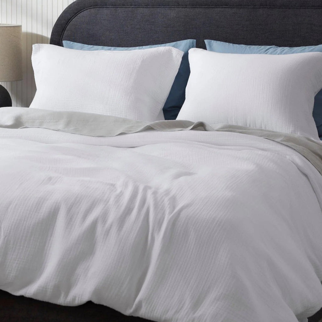 Muslin pillowcases on a white bed